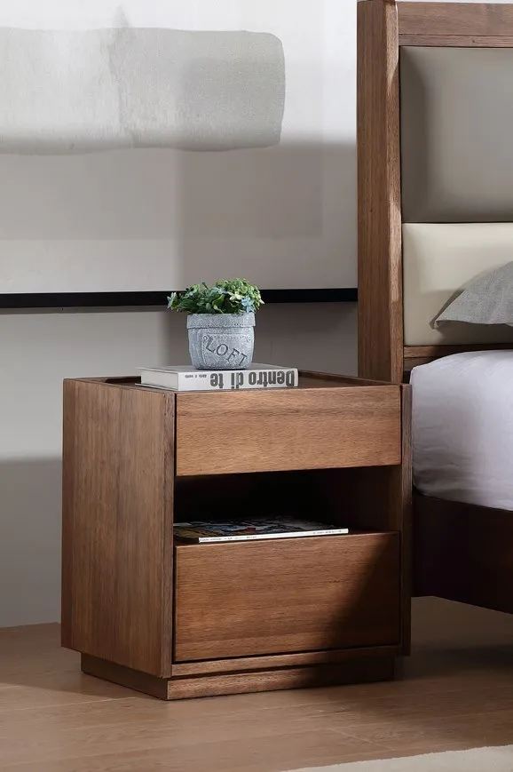 Solid wood bedside drawer with a drawer and open shelf, beside a bed